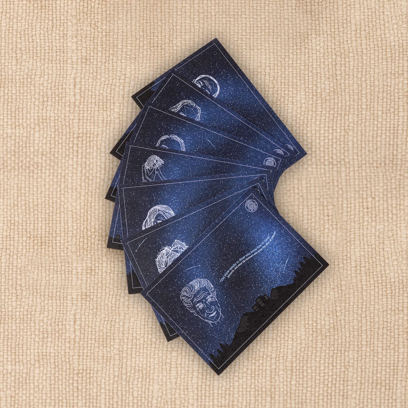 Night-sky postcard from the Kit of Here featuring portraits formed from stars with quotes from notable figures.