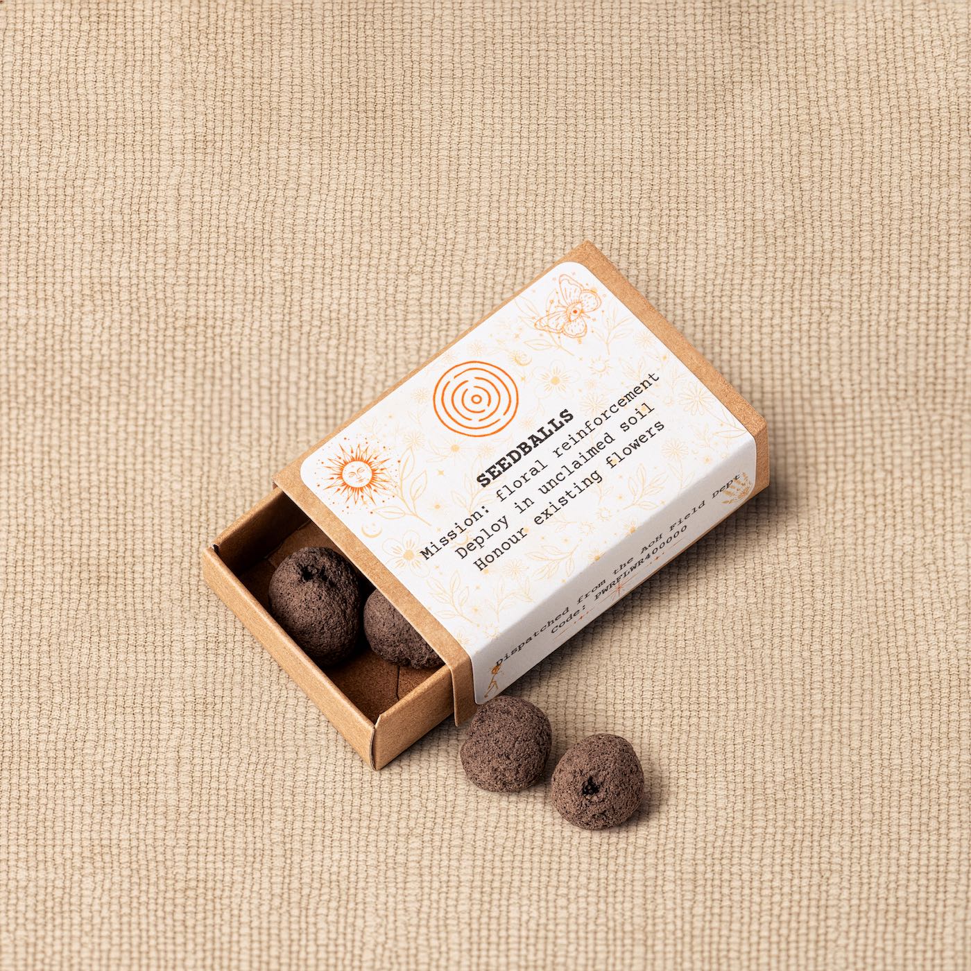 Wildflower seedballs in a small kraft box from the Kit of Here, designed for planting native flowers in local soil.